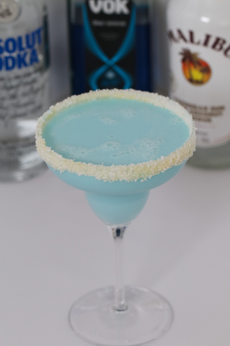 Our boozy Blue Coconut Rum Cocktail made with Malibu, Vodka, Blue Curacao, coconut water and coconut cream is deliciously refreshing!