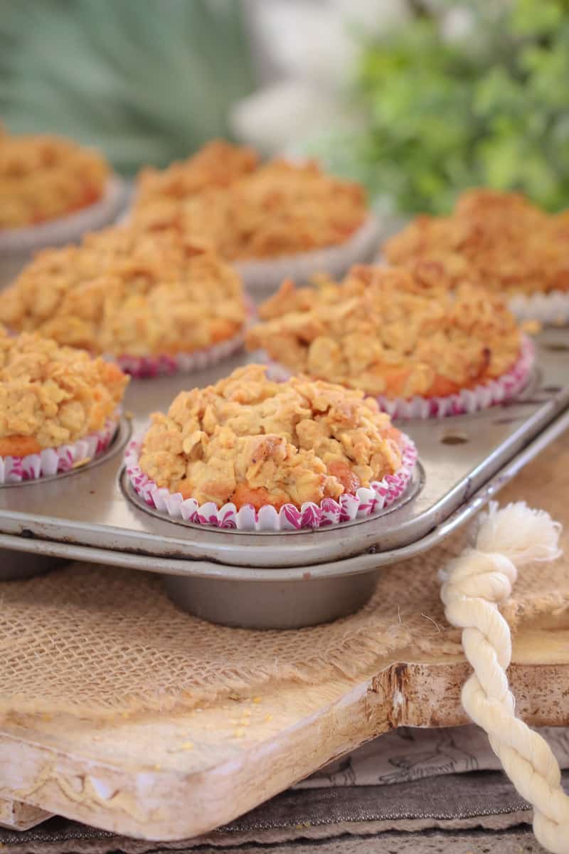 A tray of apple streusel muffins out of the oven. 