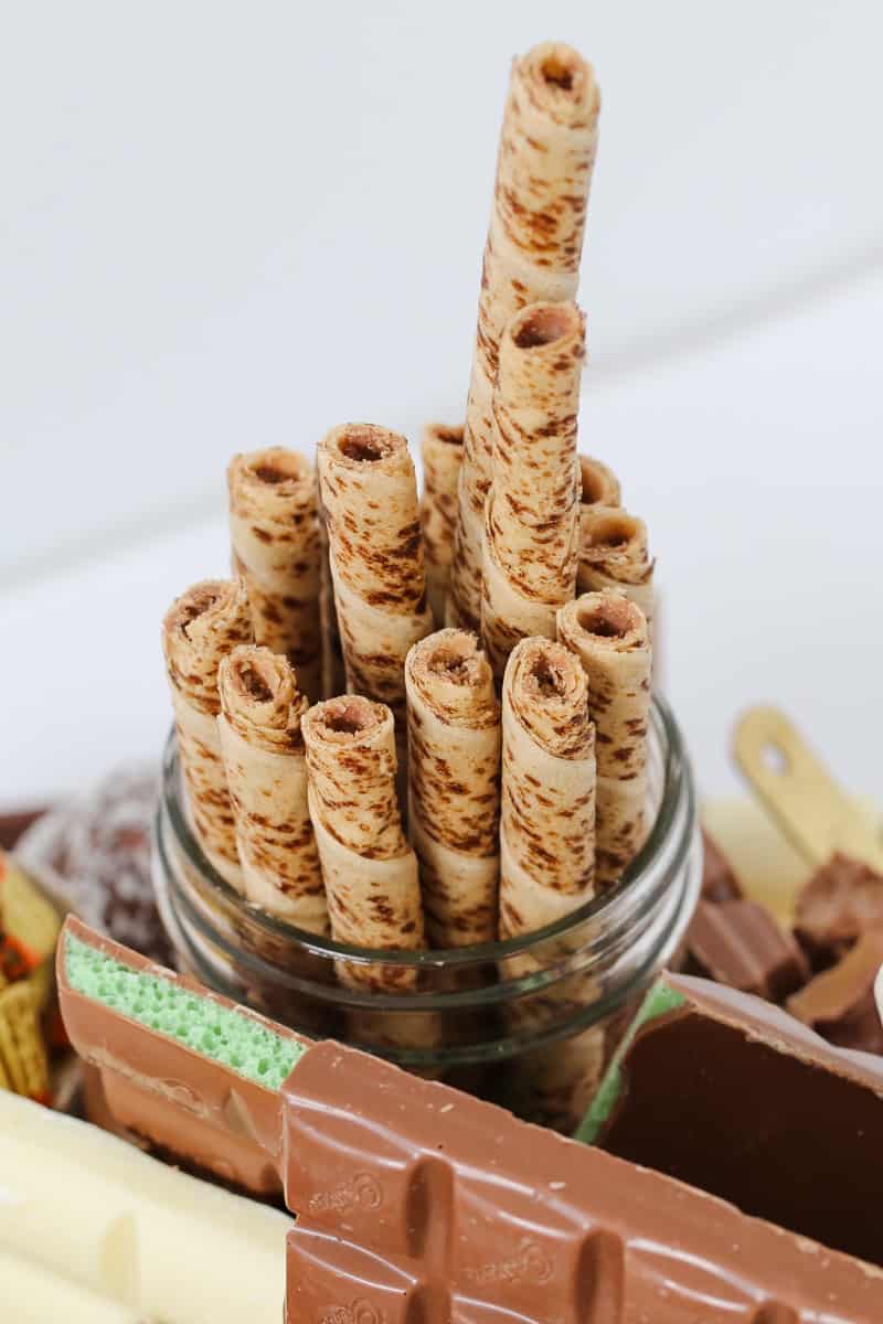 A stack of round wafer rolls in a glass jar