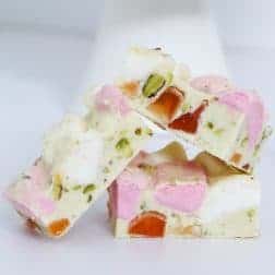 A deliciously simple 4 ingredient White Chocolate Rocky Road recipe made with marshmallows, turkish delight and pistachios.