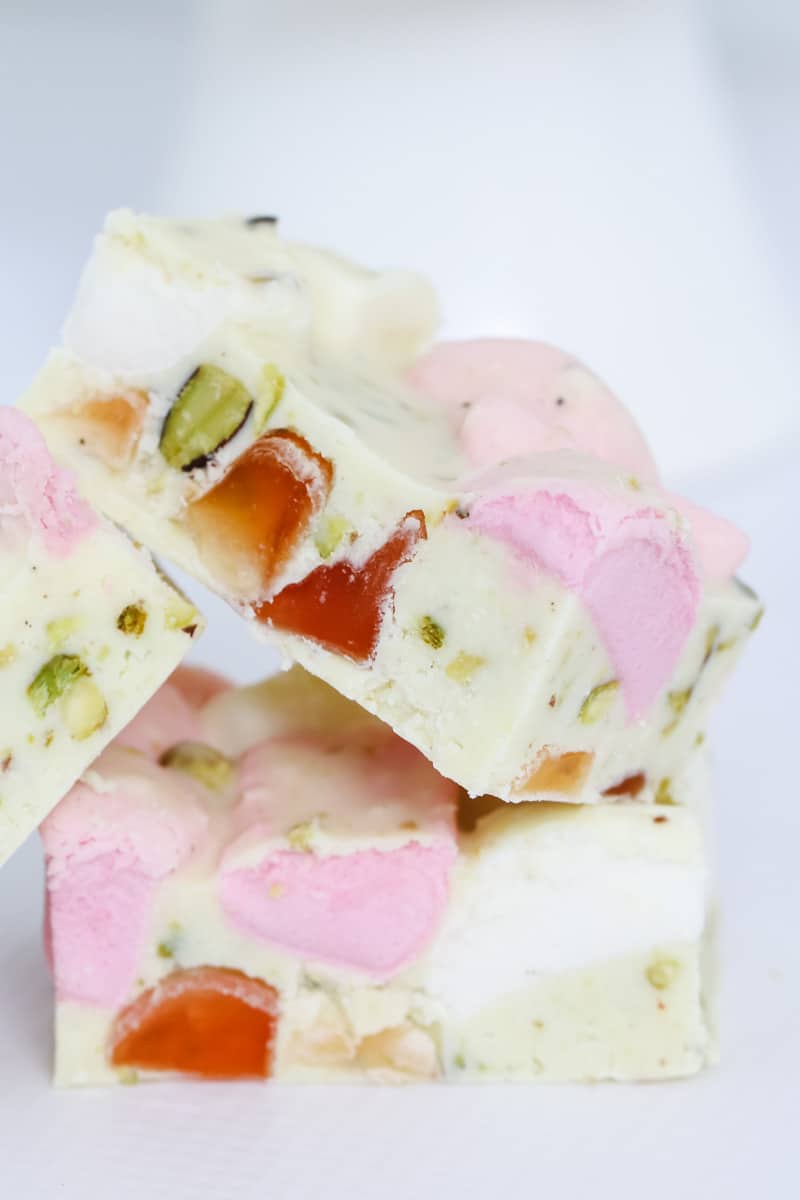 Three pieces of white Rocky Road filled with marshmallows, Turkish Delight and pistachios