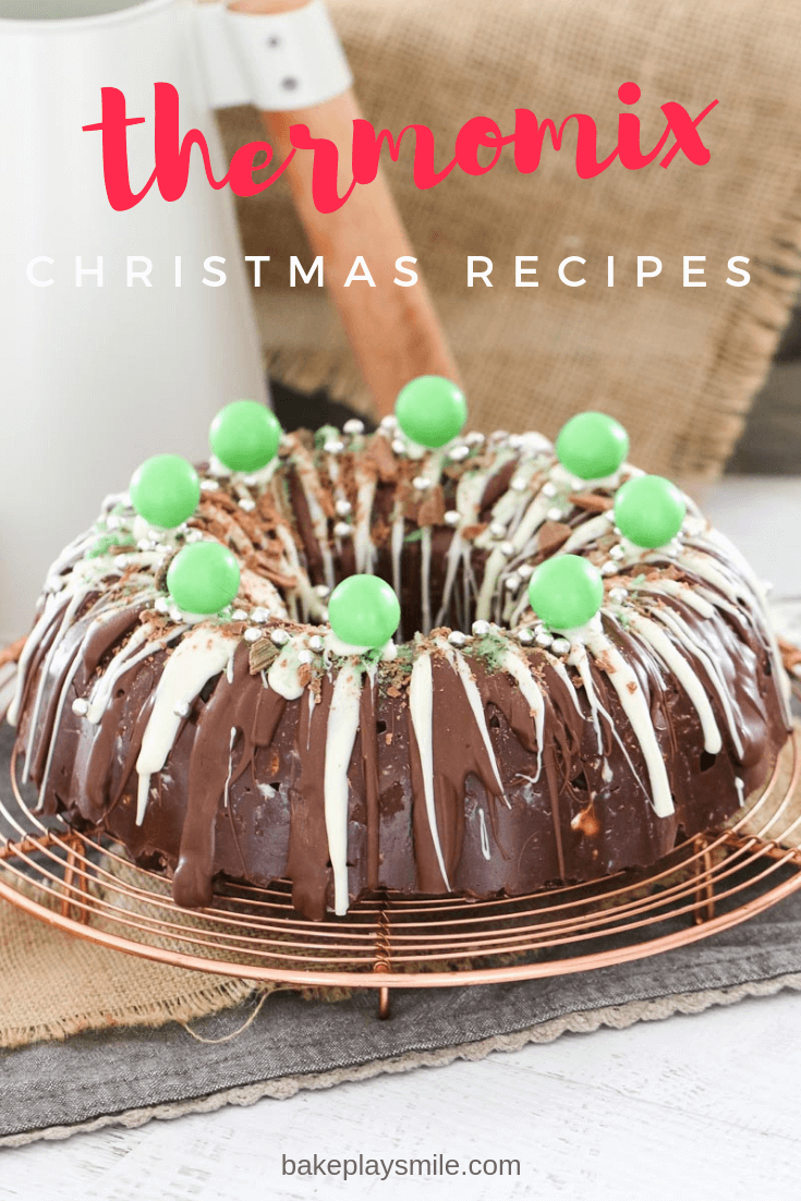 A bundt shaped wreath on a copper tray, drizzled with both milk and white chocolate, and decorated with mint balls