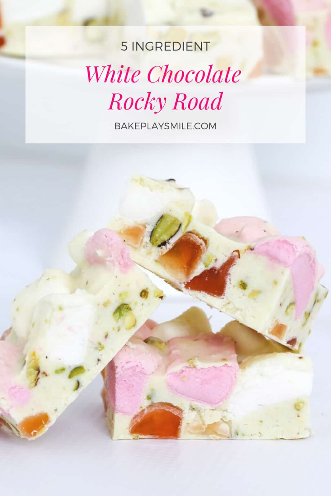 Three pieces of white chocolate rocky road piled together showing Turkish Delight, marshmallows and pistachios inside