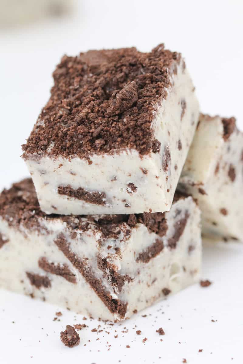 Pieces of white chocolate microwave fudge made with chopped Oreos.