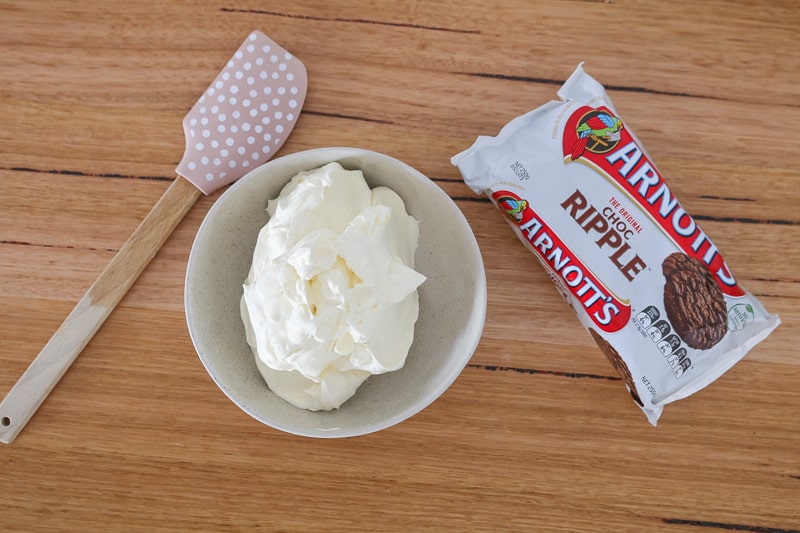 Whipped cream and Arnott's chocolate ripple biscuits. 