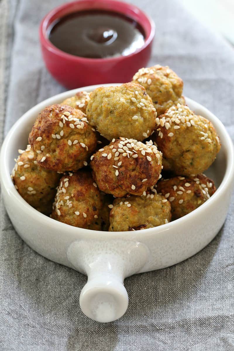 A bowl of turkey meatballs and a dipping sauce