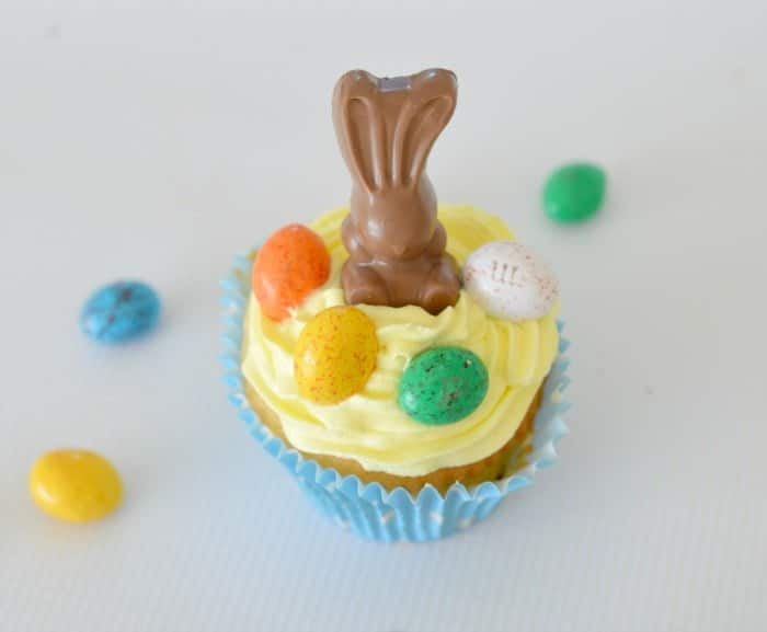 Little Easter cupcakes decorated with Malteser bunnies and speckled Easter eggs. 