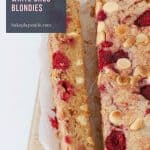 Sweet, buttery and fudgy Raspberry & White Chocolate Blondies with tart bursts of raspberries and crunchy chocolate in every bite! The perfect chewy blondie recipe. 