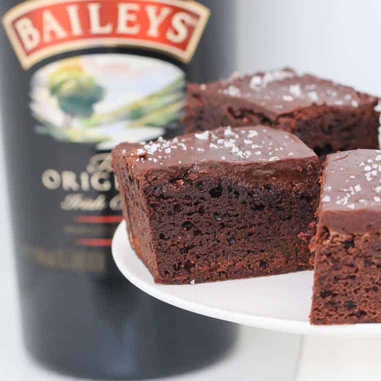 A rich and deliciously boozy chocolate Baileys Brownies recipe made with Irish cream liqueur and topped with a smooth chocolate frosting. 