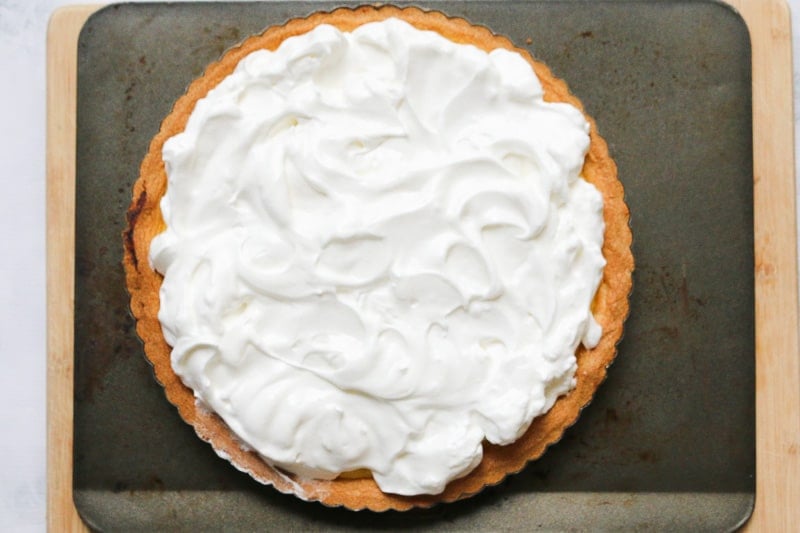 Whipped egg whites on top of a pastry pie base.