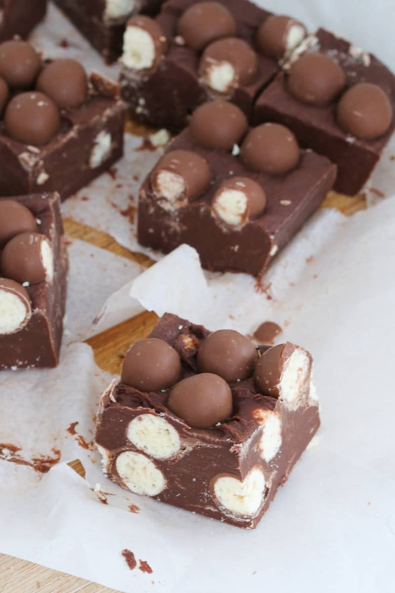 Maltesers on top of a chocolate slice.