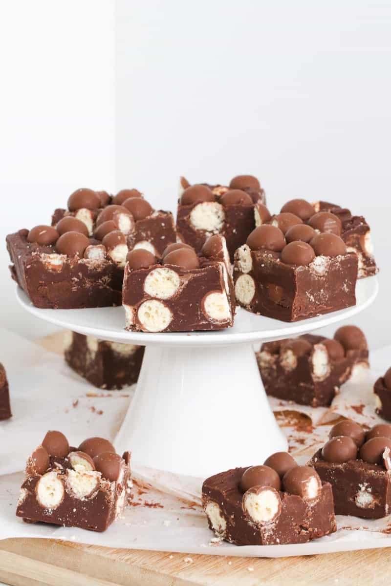 Malted milk chocolate fudge pieces on a cake stand.