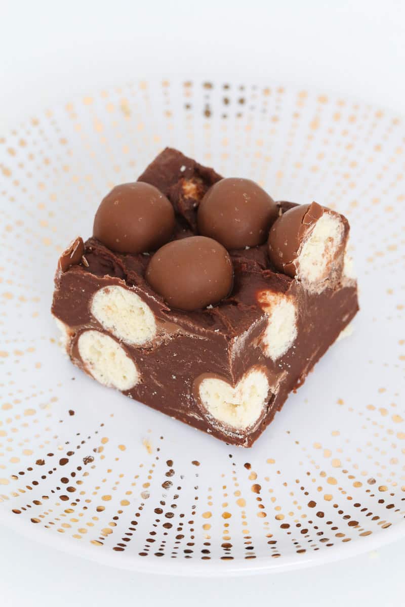 A square of chocolate fudge filled with Maltesers.
