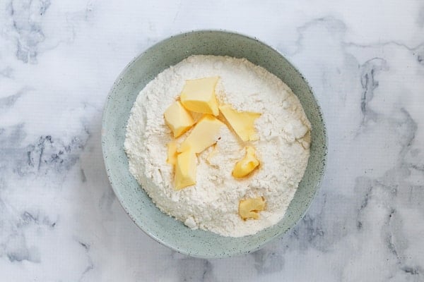 Butter and self-raising flour in a bowl.