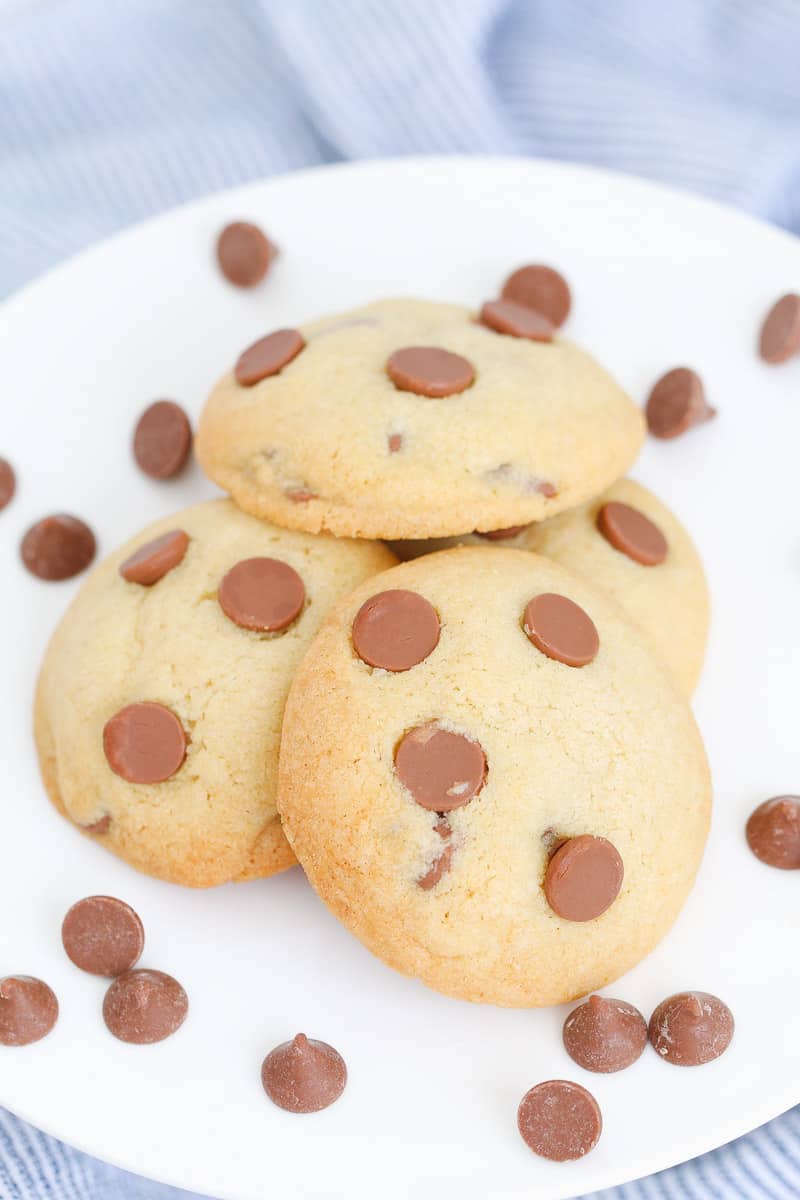A close up of chocolate chip biscuits on a plate.