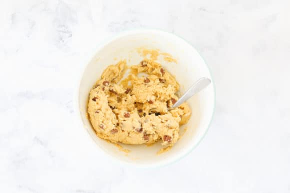 Choc chip cookie dough in a bowl.