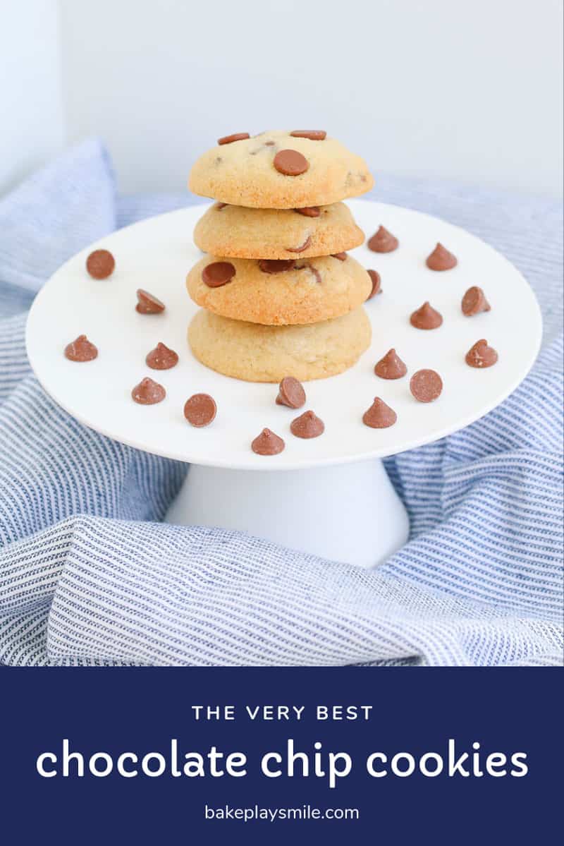 A stack of choc chip cookies on a plate. 