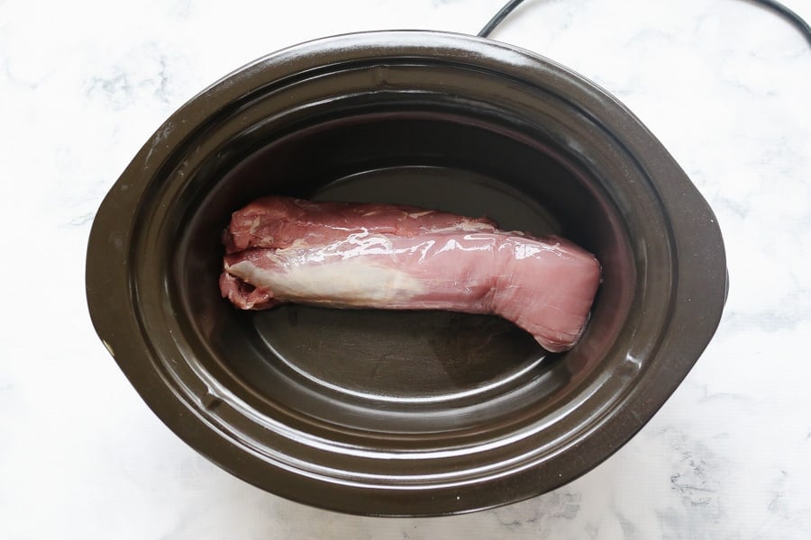 A pork fillet in a slow cooker. 