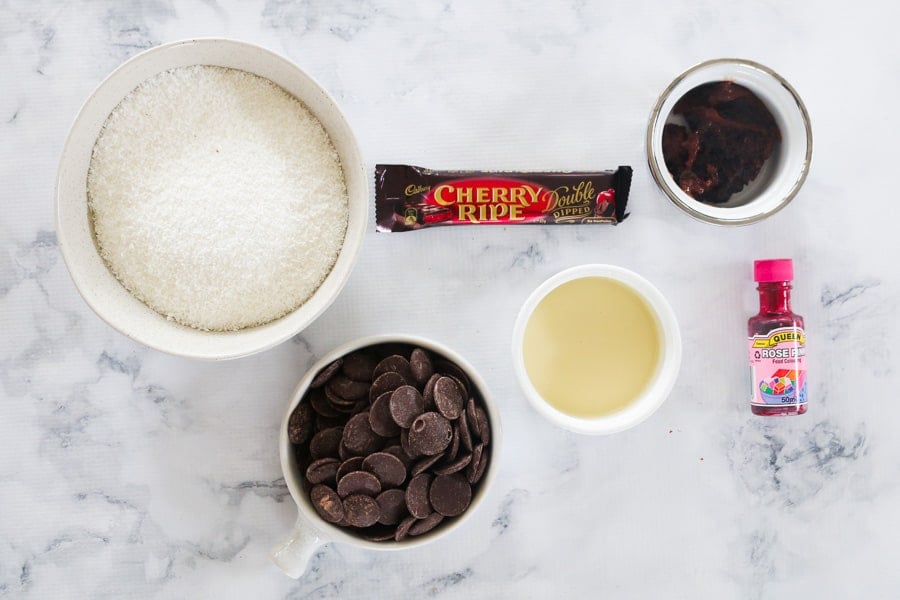 The ingredients needed to make cherry and coconut balls.