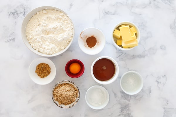 The ingredients for homemade gingerbread in individual bowls. 