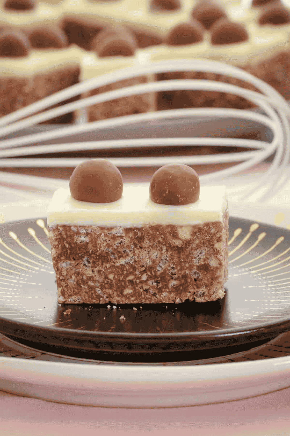 A piece of Malteser slice on a plate.