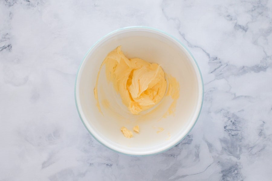 Creamed butter in a mixing bowl. 