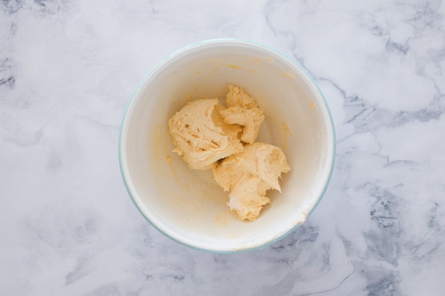 Creamed shortbread mixture in a mixing bowl. 