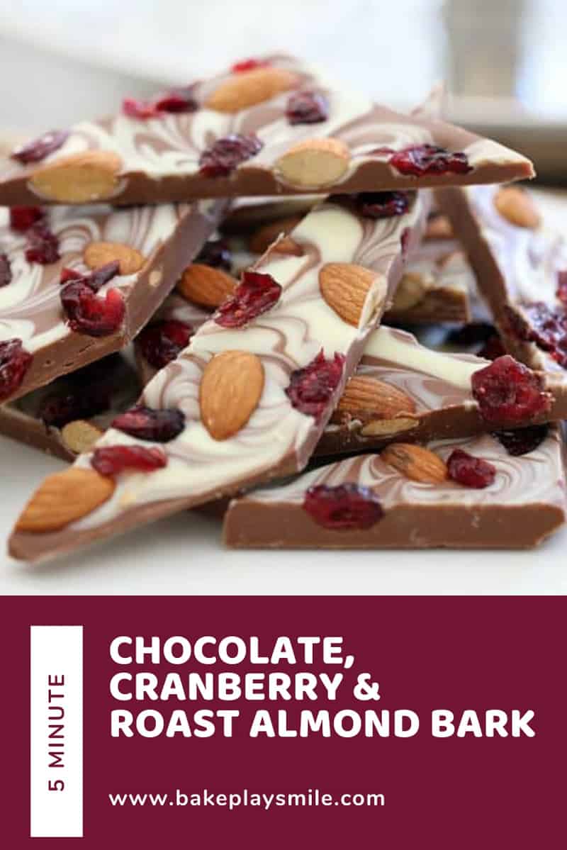 Pieces of chocolate bark made with roasted almonds and cranberries.