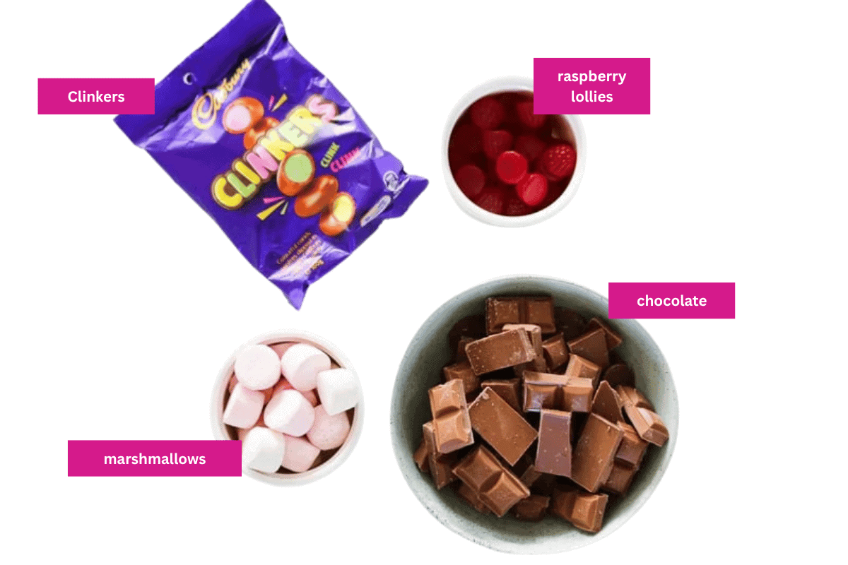 Clinkers, chocolate, raspberry lollies and marshmallows in small bowls.
