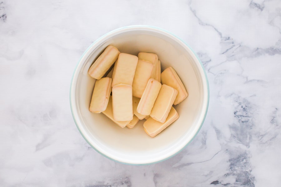 White chocolate Tim Tams in a bowl.