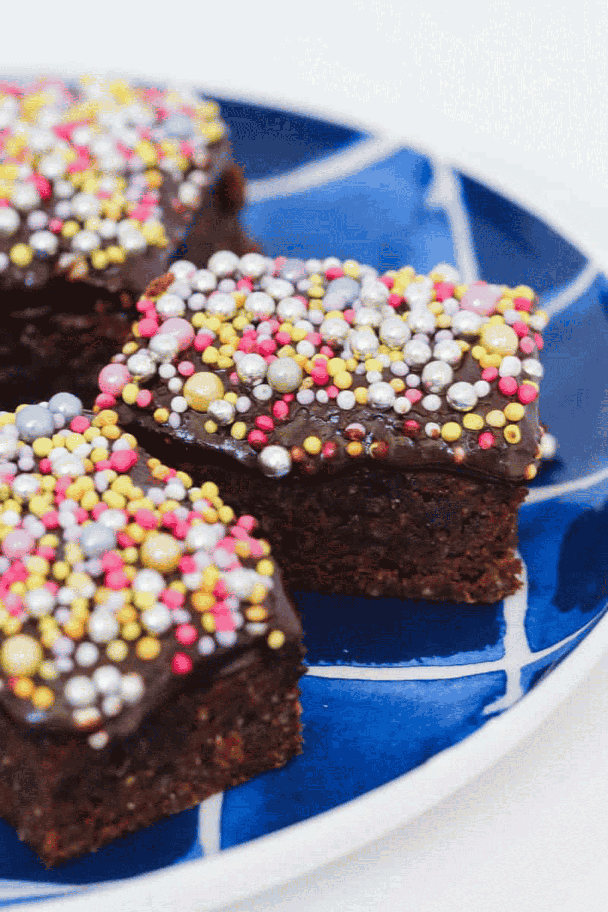 Chocolate sprinkles baked slice on a plate.