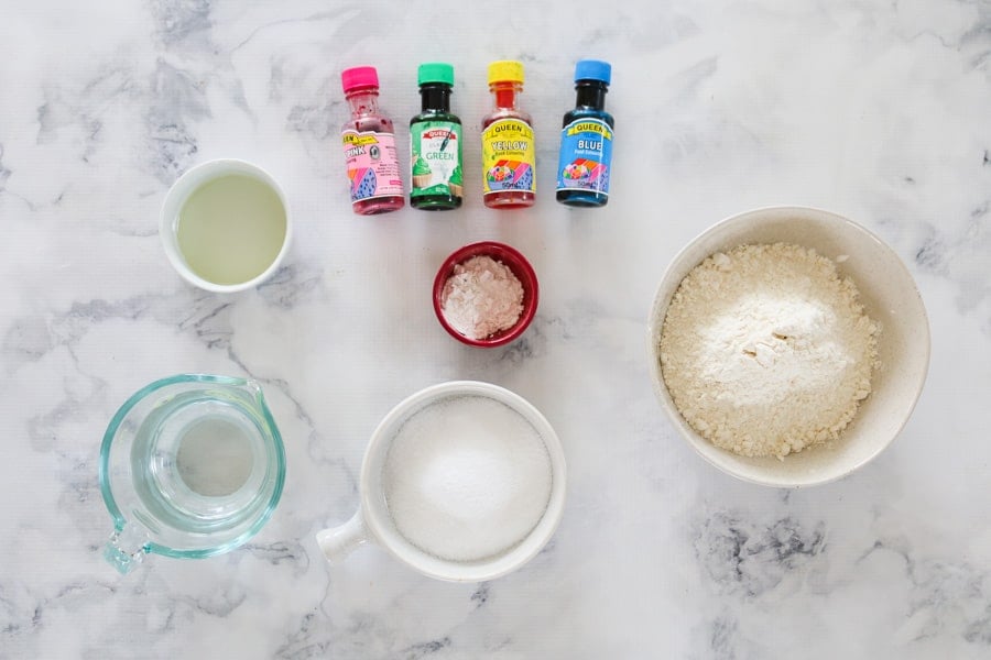 The ingredients for homemade cooked playdough - cream of tartar, flour, water, oil, salt and colouring.