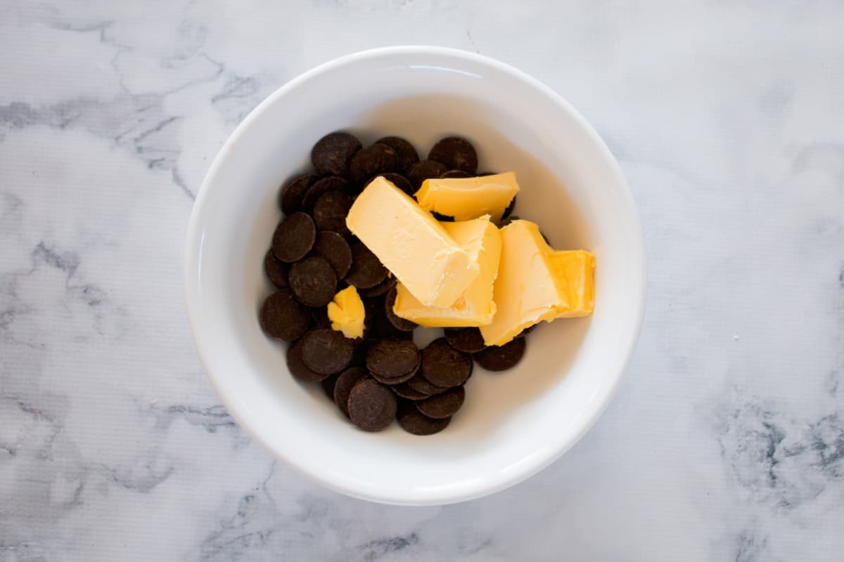 Butter and chocolate in a mixing bowl.