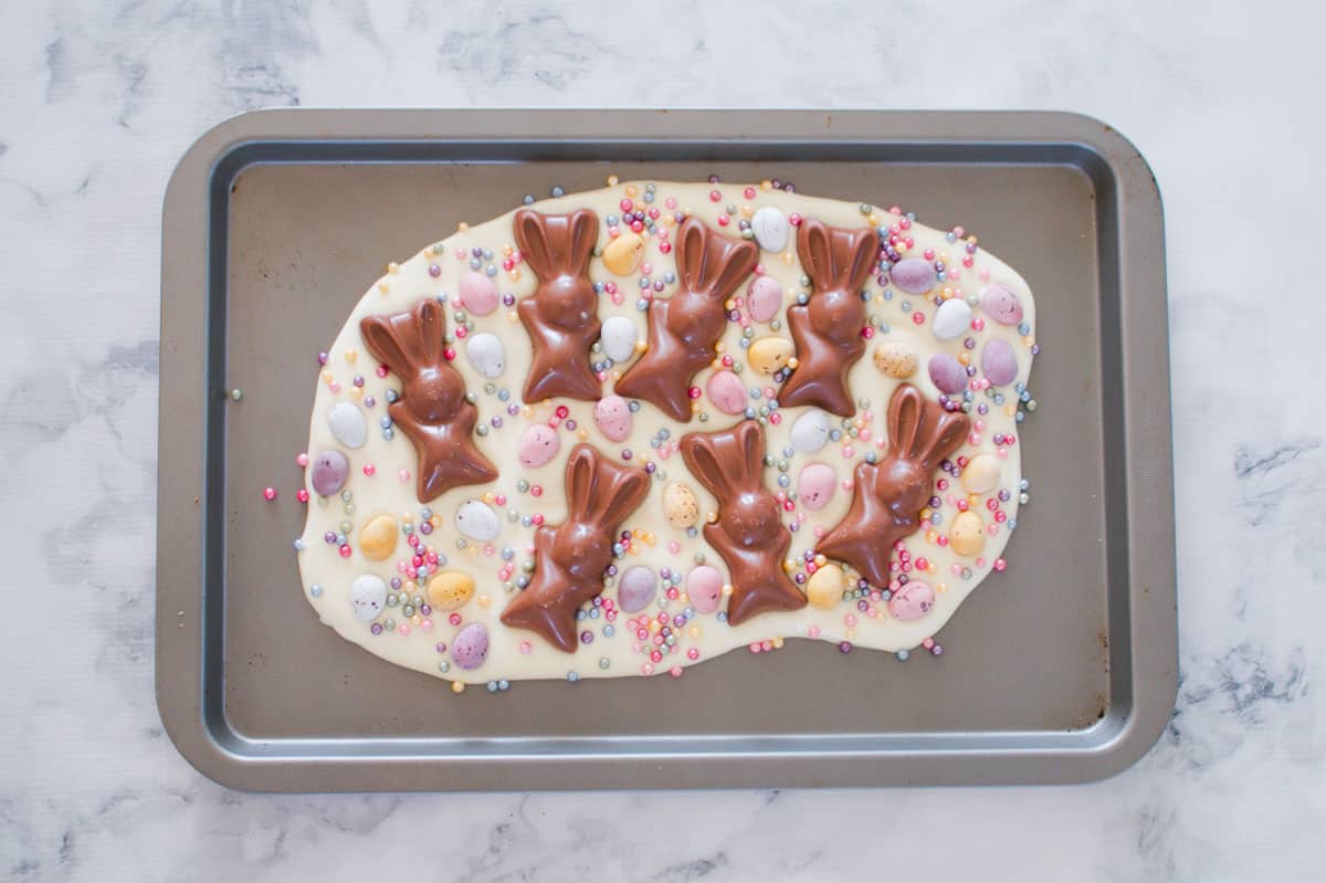 A bright and colourful Easter bark recipe made with chocolate eggs, sprinkles and bunnies.