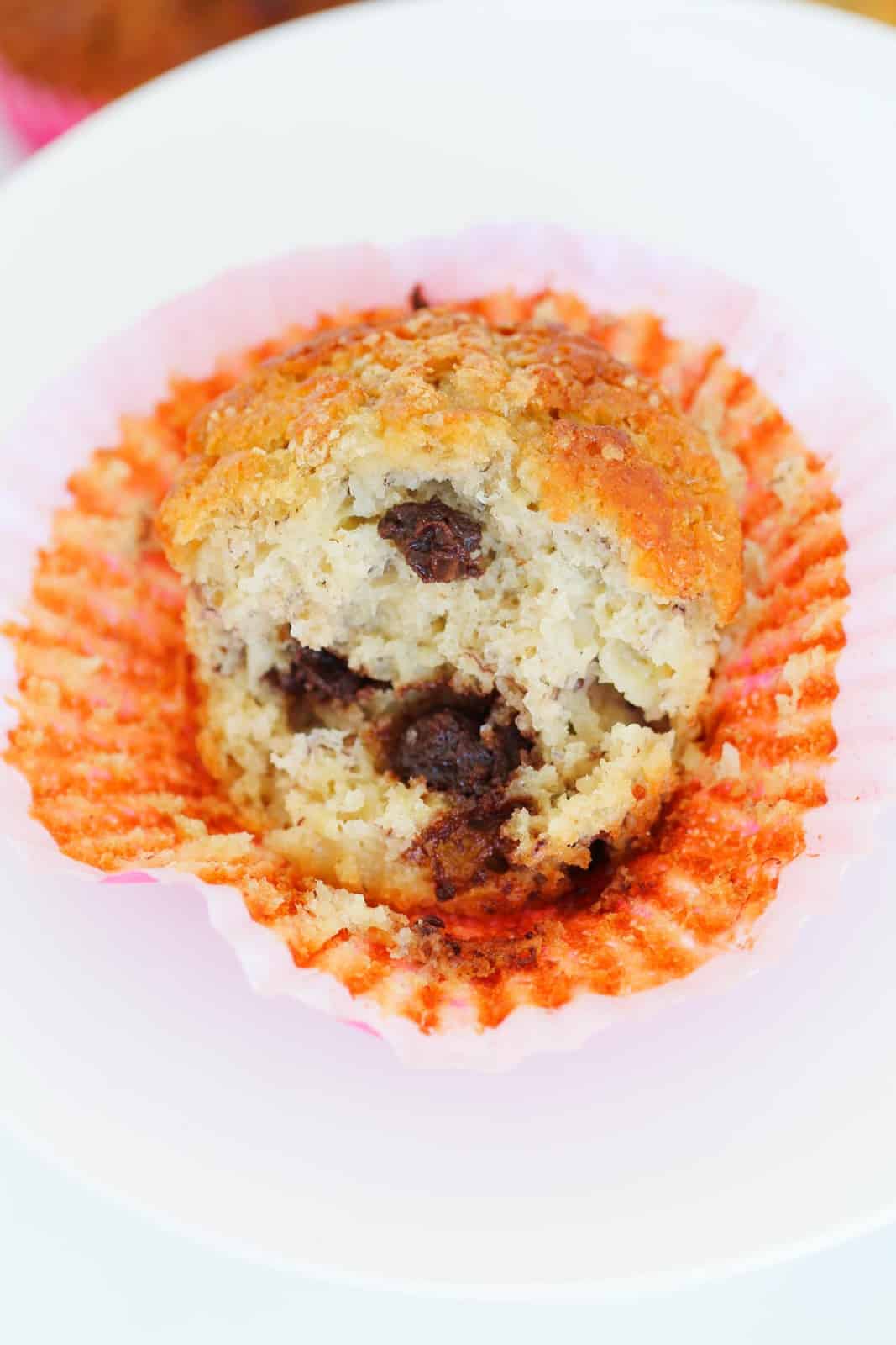 A soft and fluffy banana muffin with dark chocolate chips.
