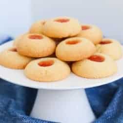 Our old fashioned jam drops are the most delicious melt-in-your mouth thumbprint cookies filled with sweet jam! Made from just 6 ingredients with less than 10 minutes preparation time! #jam #drops #cookies #biscuits #thumbprint #thermomix #conventional #lunchbox #snacks