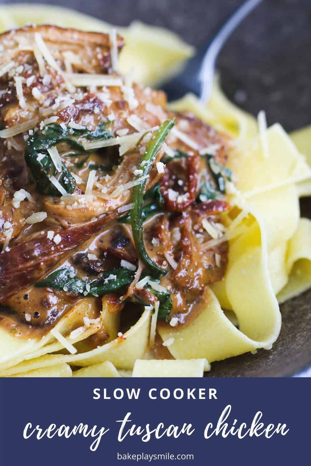 Creamy Tuscan Slow Cooker Chicken with sun-dried tomatoes, baby spinach and parmesan cheese is the ultimate winter comfort food. Serve with pasta for a simple meal the whole family will love. #creamy #tuscan #slowcooker #crockpot #chicken #dinner #family #recipe #meal 