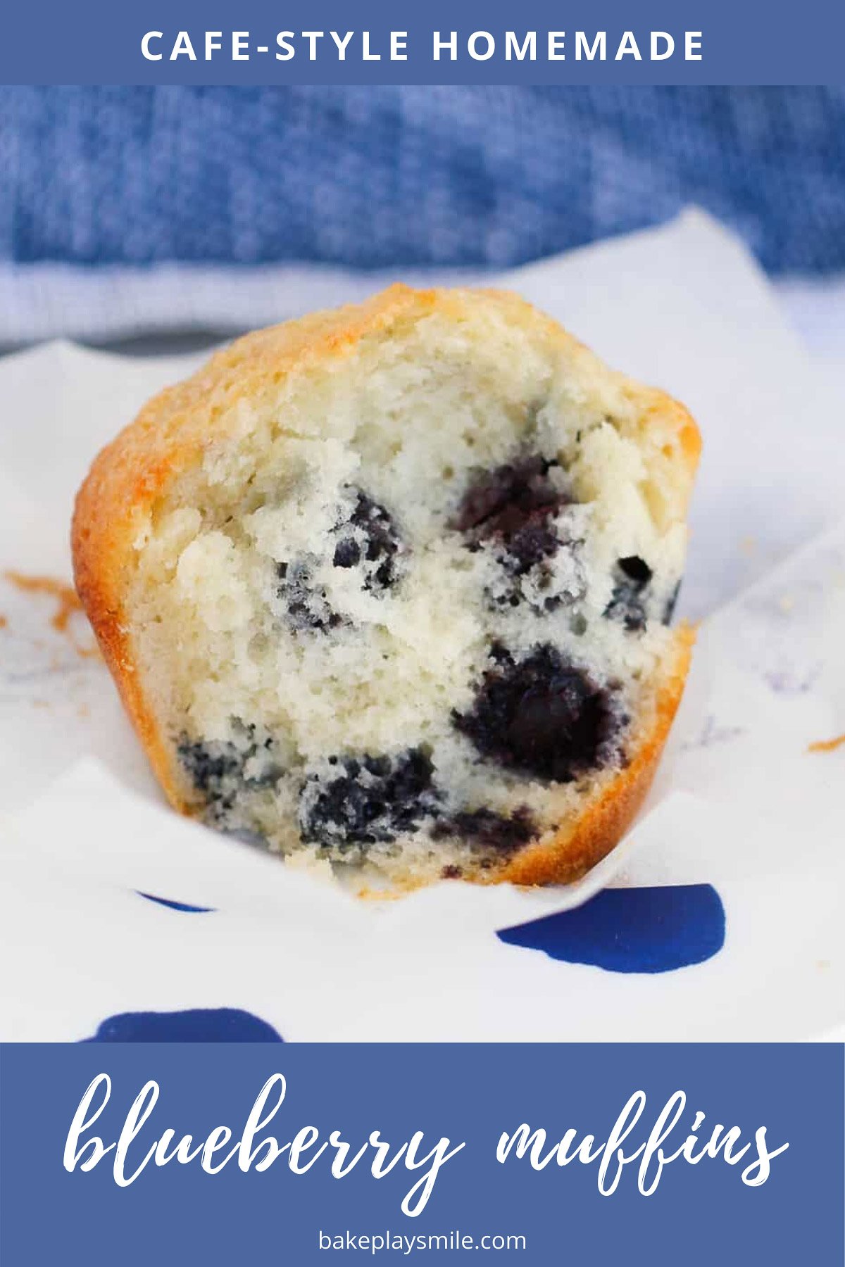 A half-eaten sweet white muffin with blueberries mixed throughout.