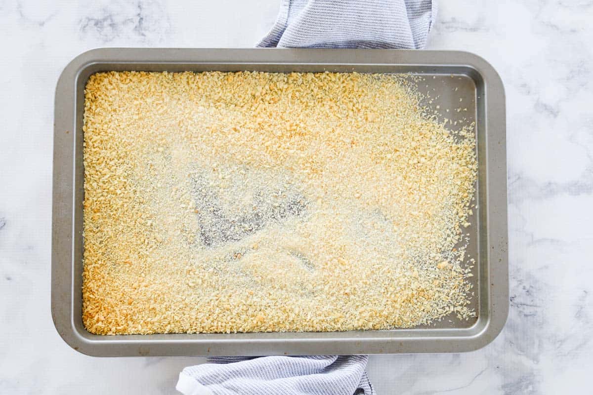 Panko crumbs that have been baked to golden on a baking tray.
