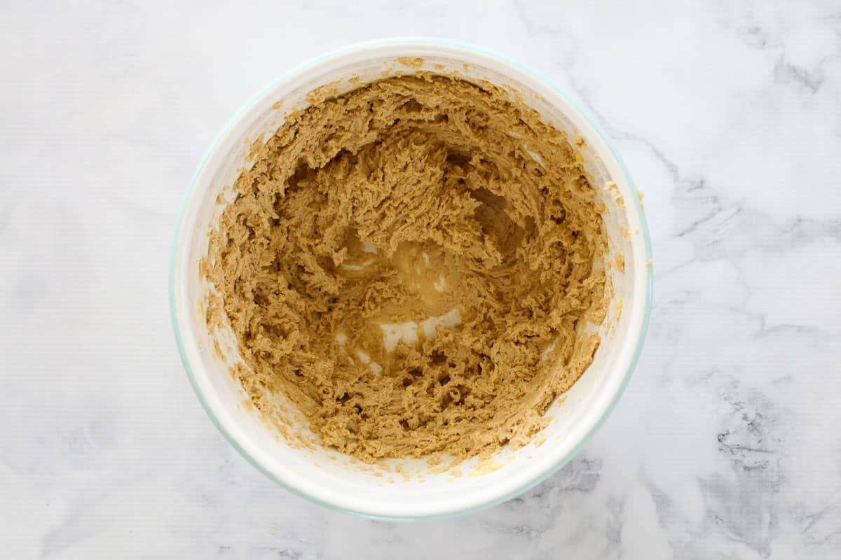 Creamed butter and sugar in a white bowl.
