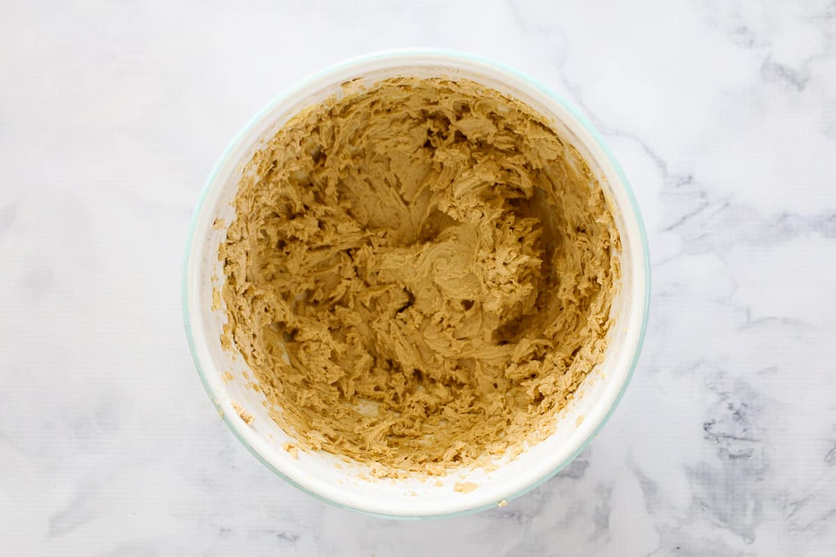 Beaten cookie dough in a bowl.