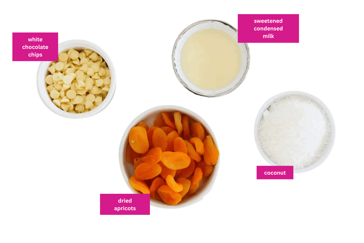 Condensed milk, apricots, white chocolate and coconut in small bowls.