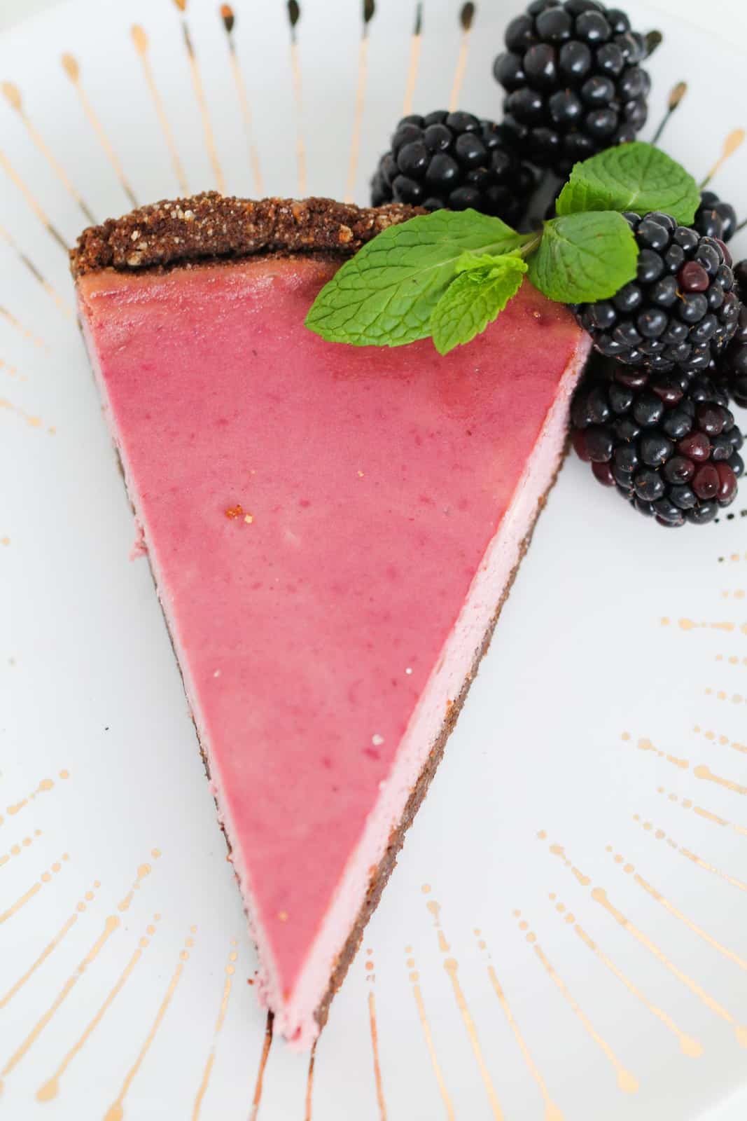 A slice of blackberry cheesecake.