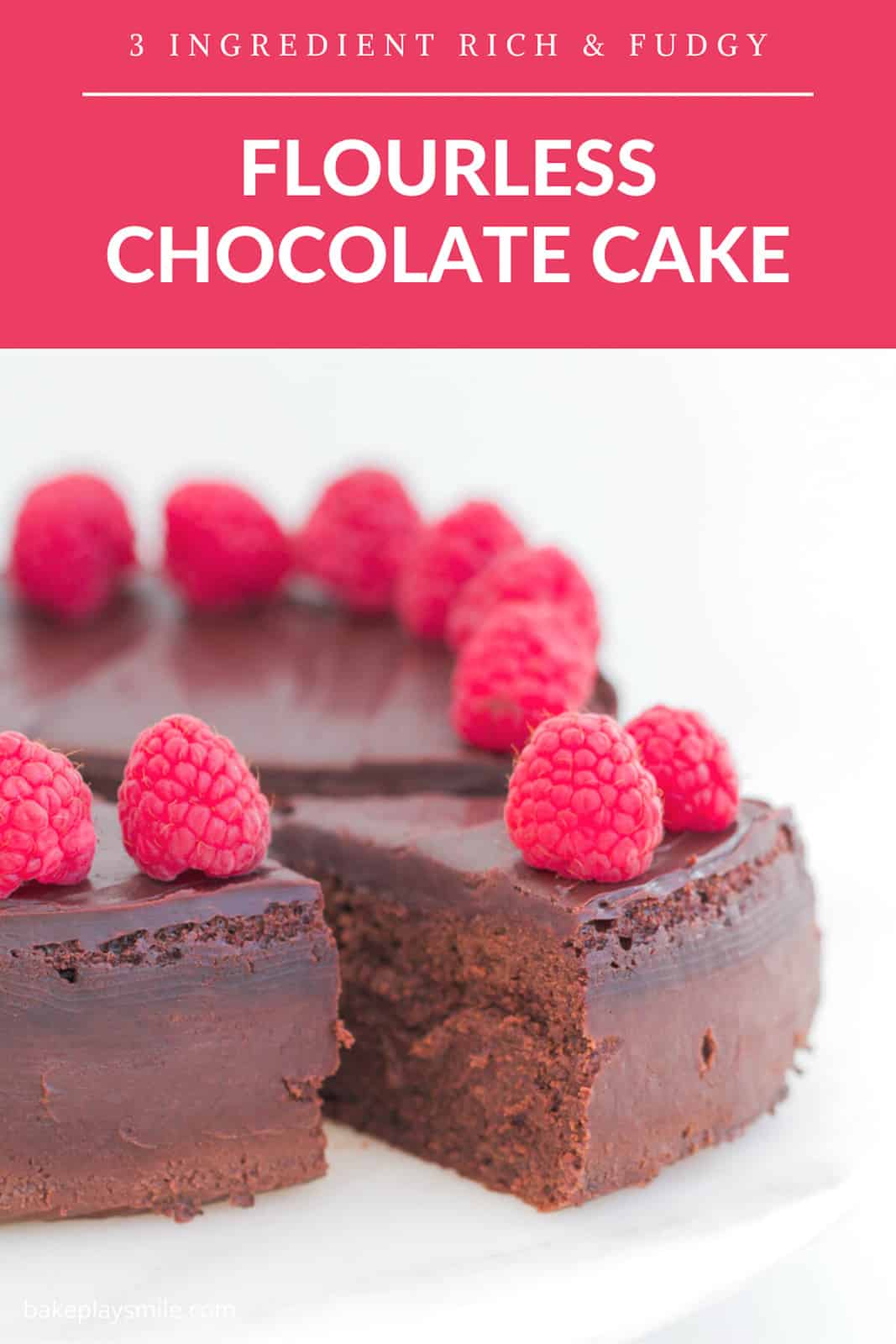 A section of a round chocolate mousse dessert cake sliced with raspberries and chocolate ganache.