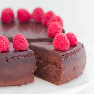 A rich mousse chocolate cake with raspberries and chocolate ganache.