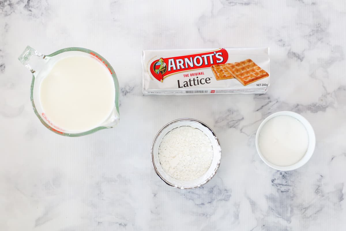 Bowls of ingredients for a vanilla slice, and a packet of Arnotts Lattice biscuits.