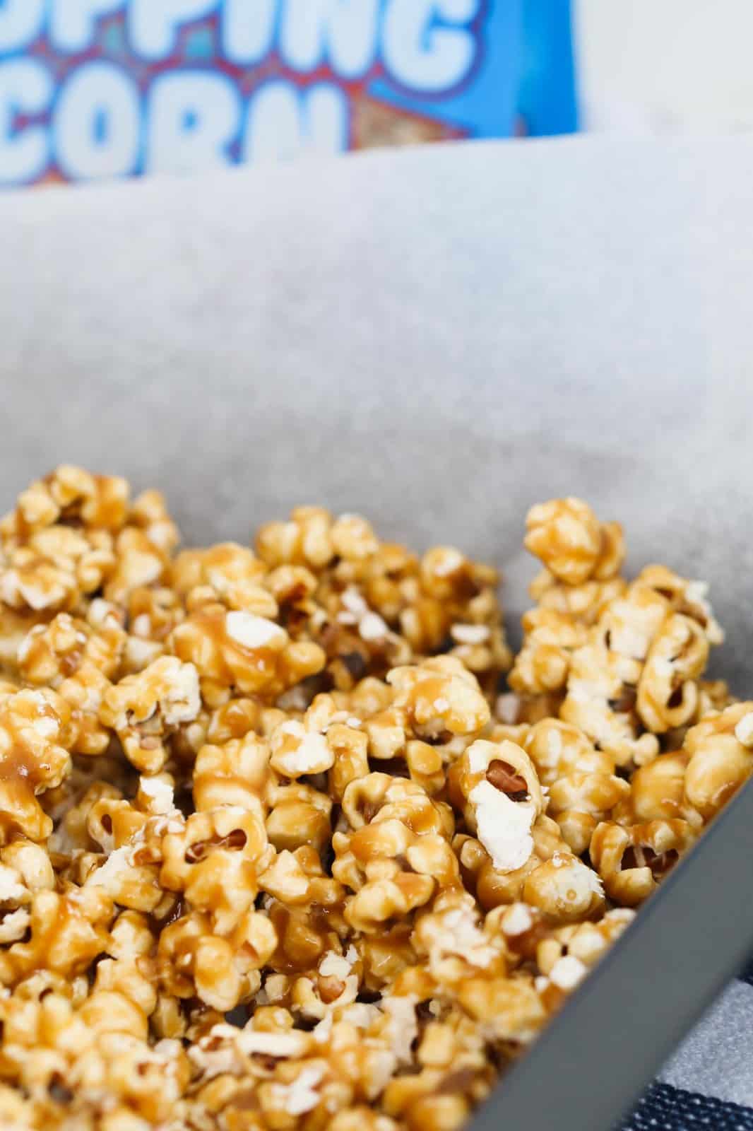 Caramel popcorn with salt on a tray covered with baking paper