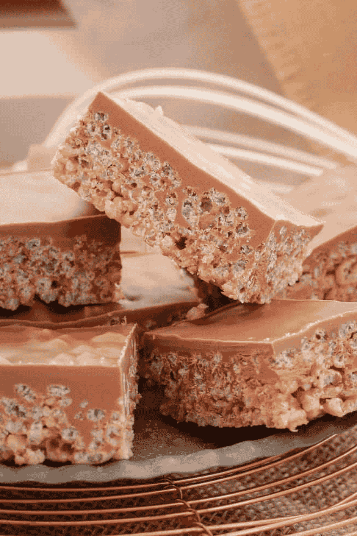 Chocolate rice bubble Mars Bar Slice pieces with melted chocolate on top.