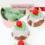 A plate of marshmallow biscuits decorated to resemble Christmas puddings
