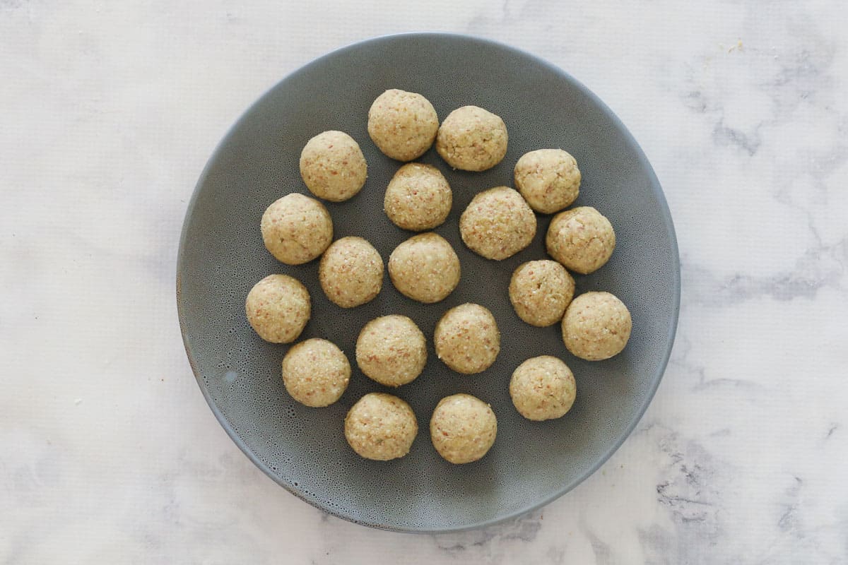 A plate of round uncoated cheesecake balls.